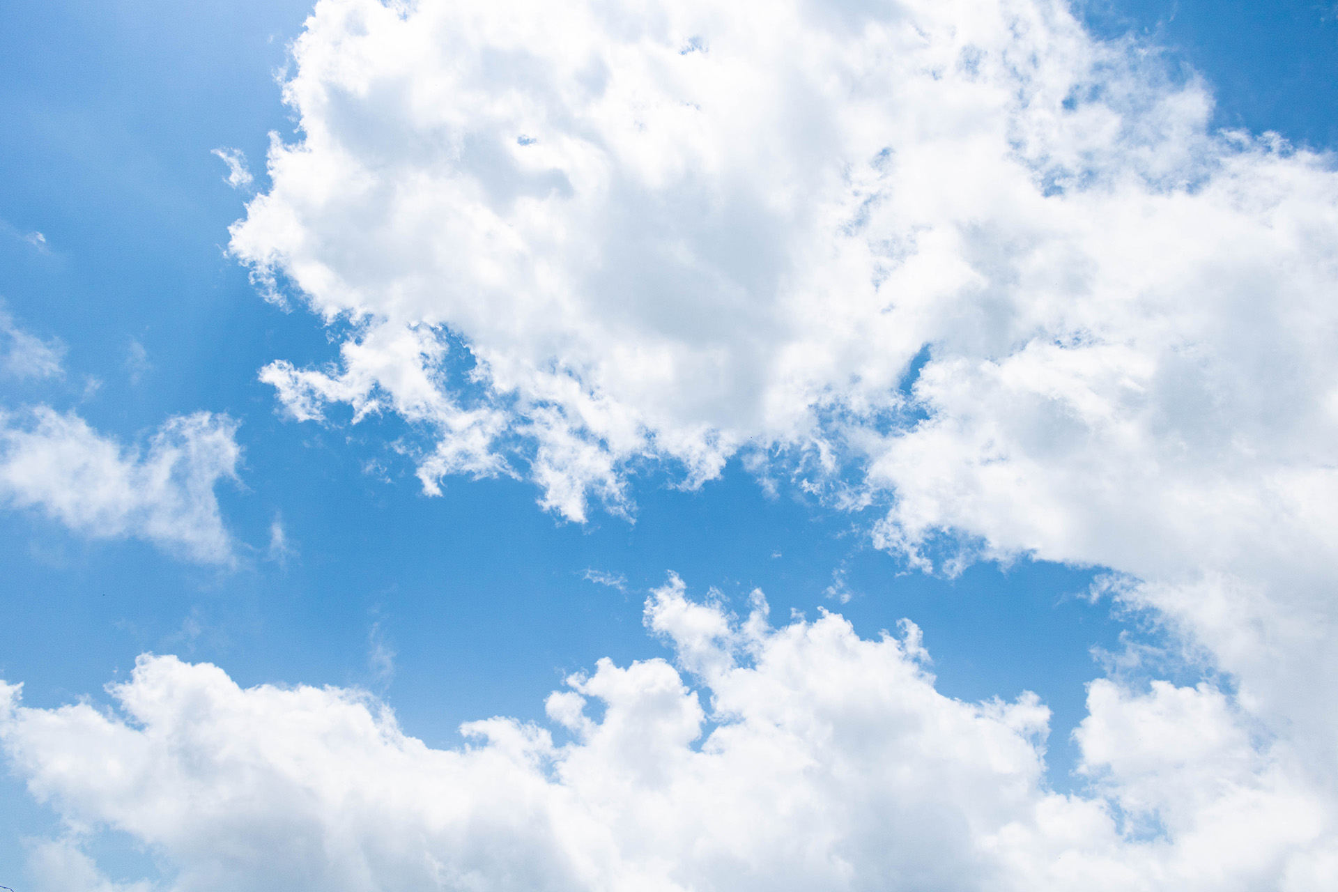 White clouds in the blue sky.